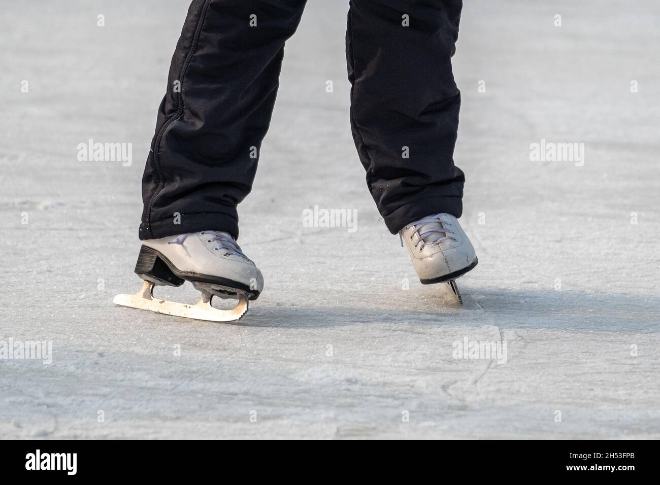 Feet in the skates on ice Stock Photo Alamy