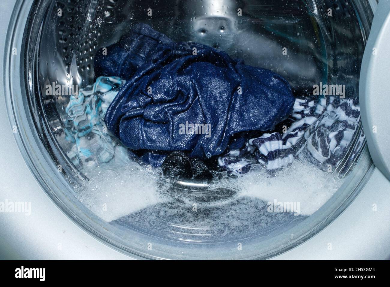 Linen washing in the washing machine Stock Photo Alamy
