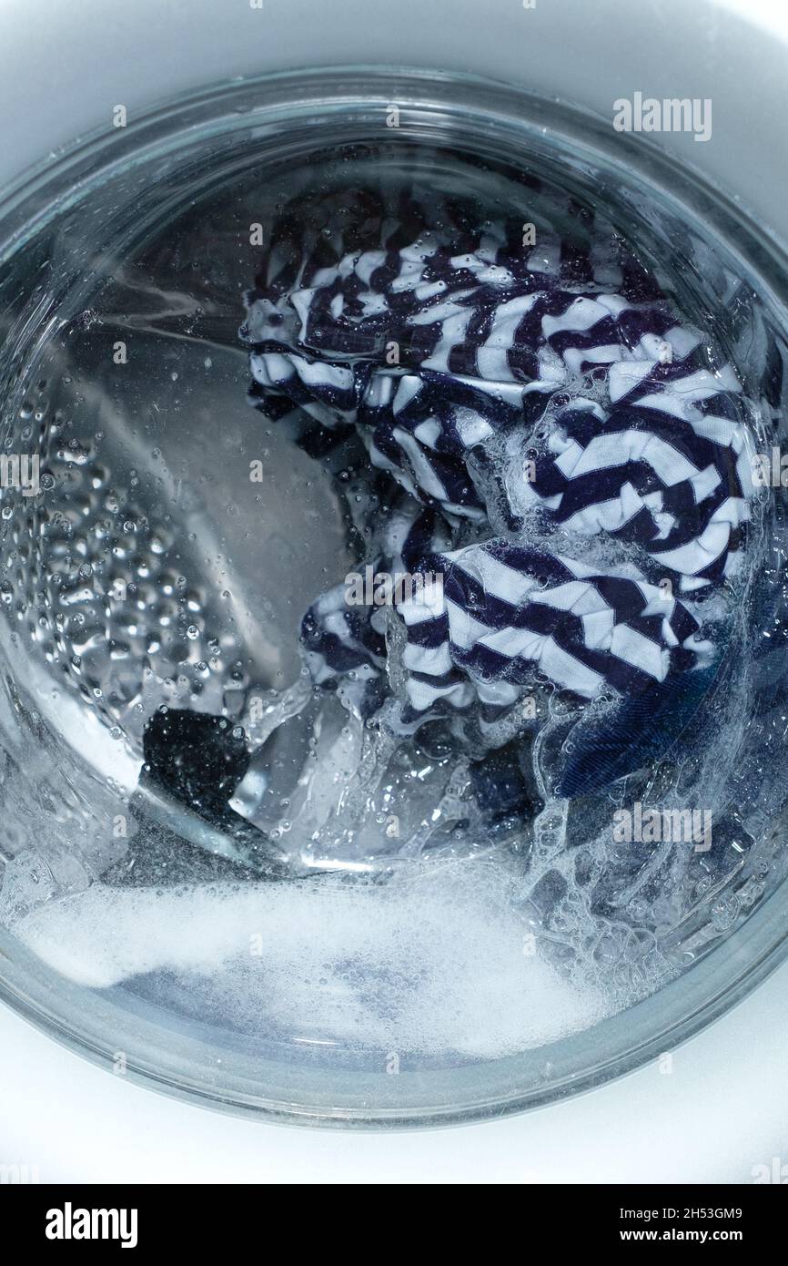 Linen washing in the washing machine. Stock Photo