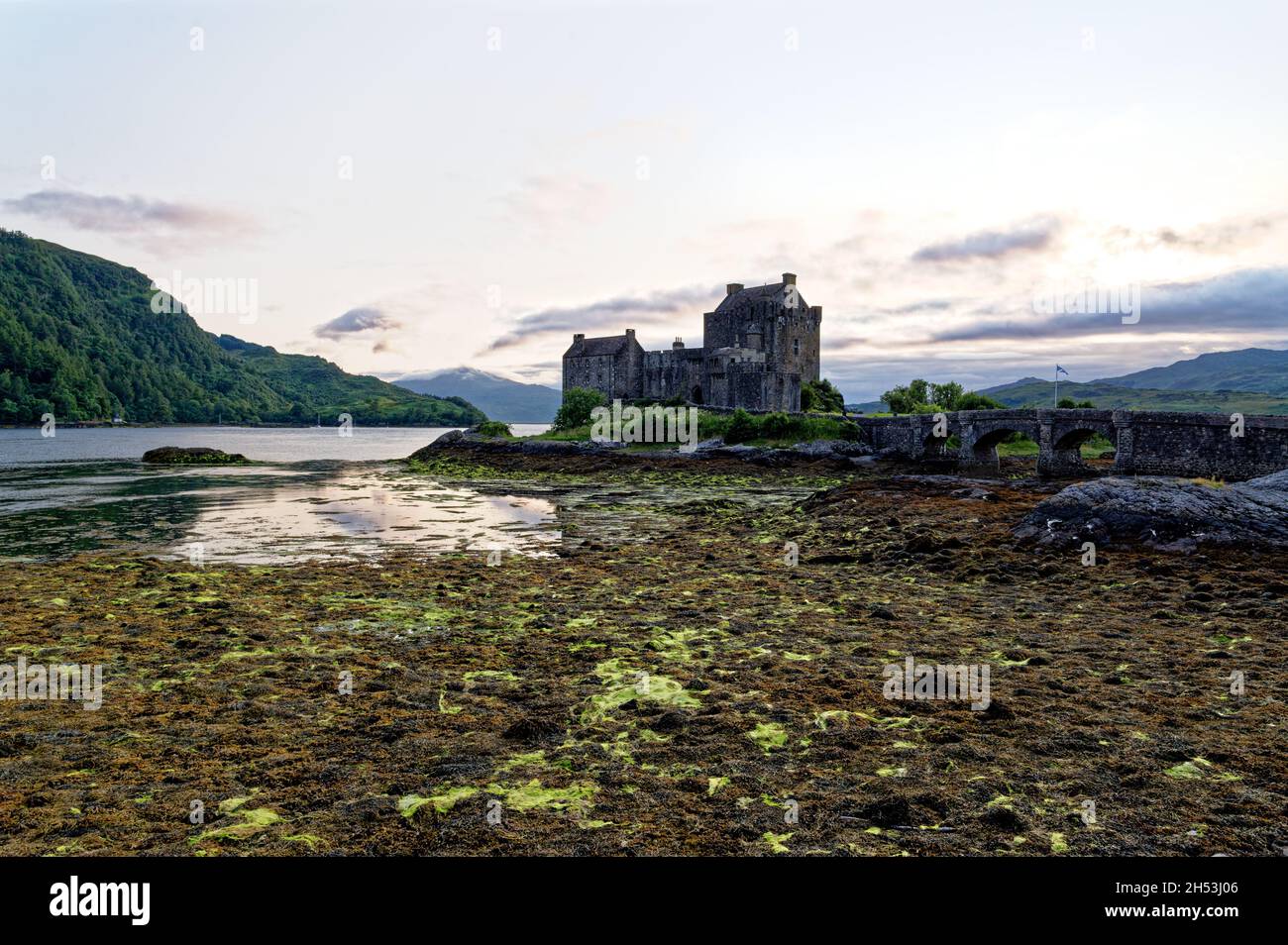Eilean Donan Castle on Loch Duich at sunset, Dornie, Western Highlands, Scotland, United Kingdom. 19th of July 2021 Stock Photo
