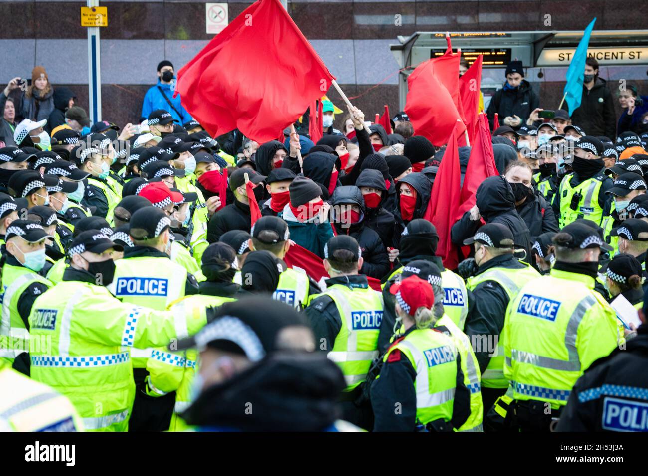 Glasgow, UK. 06th Nov, 2021. The Young Communist League get kettled by police during the Global Day of Action.ÊThe protest sees movements mobilising against the world leaders attending the COP26 Climate summit. Credit: Andy Barton/Alamy Live News Stock Photo
