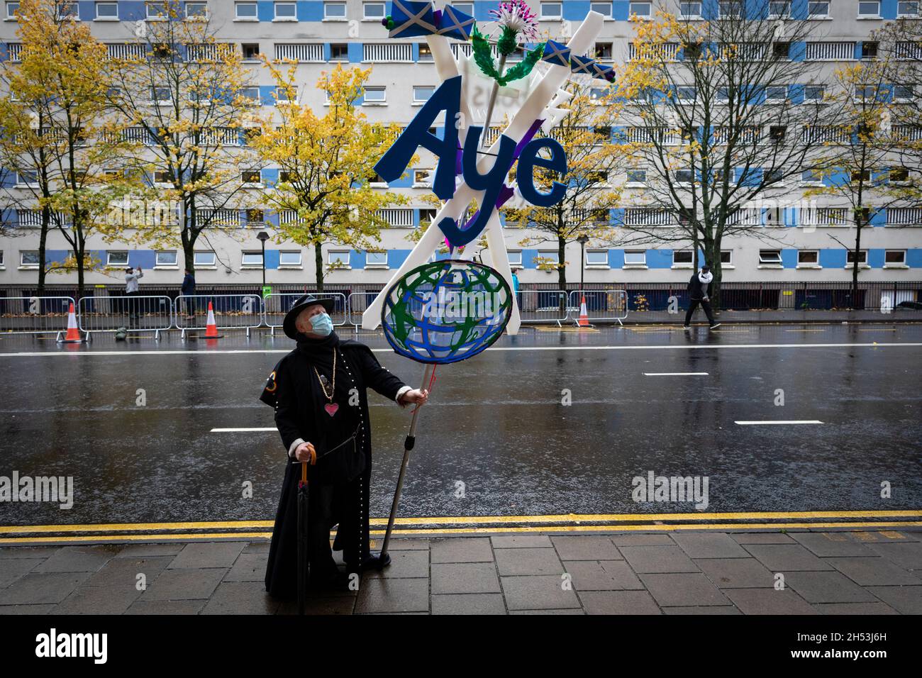 Glasgow, UK. 06th Nov, 2021. A protester with a placard awaits the start of the Global Day of Action.ÊThe protest sees movements mobilising against the world leaders attending the COP26 Climate summit. Credit: Andy Barton/Alamy Live News Stock Photo