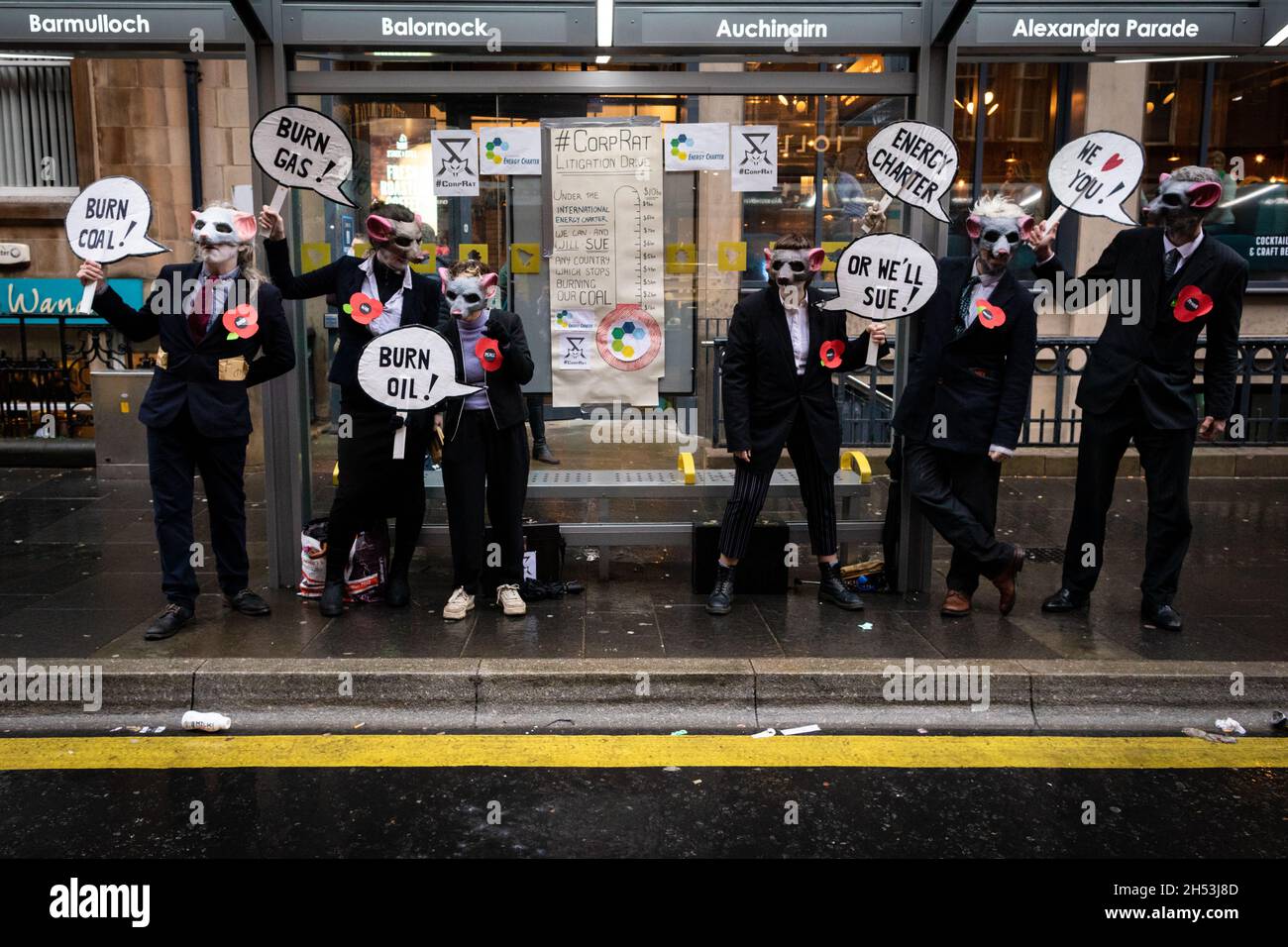 Glasgow, UK. 06th Nov, 2021. Protesters dressed up as rats in suits stand with a placards during the Global Day of Action.ÊThe protest sees movements mobilising against the world leaders attending the COP26 Climate summit. Credit: Andy Barton/Alamy Live News Stock Photo