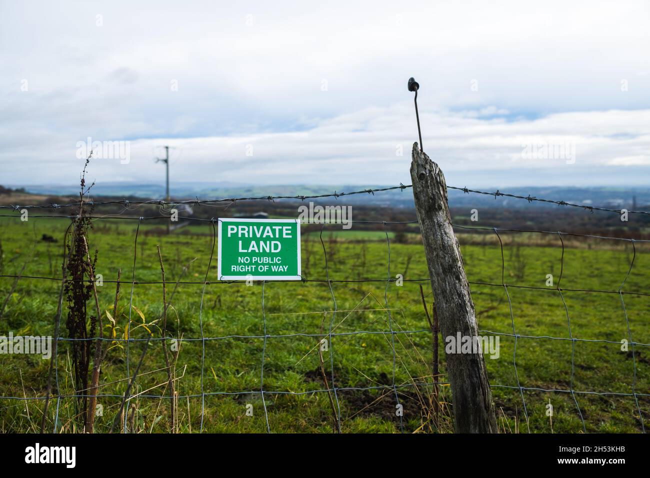 private land sign on old barbed wire fence Stock Photo