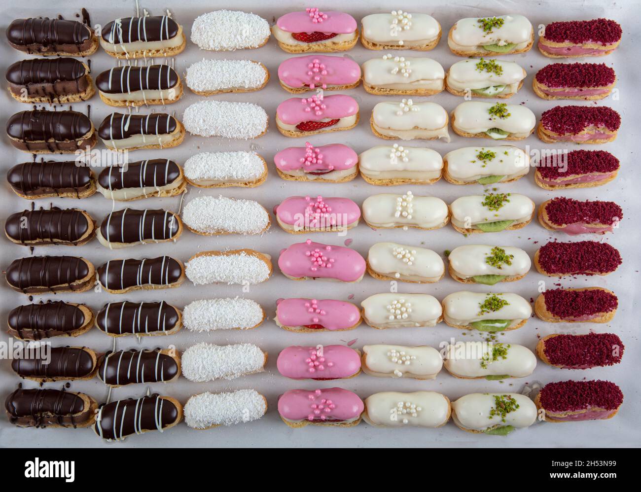 Ekler Pasta Chocolate Donut in plate. A lot of french dessert of ...