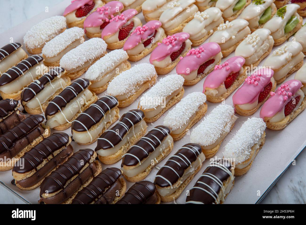 Ekler Pasta Chocolate Donut in plate. A lot of french dessert of ...