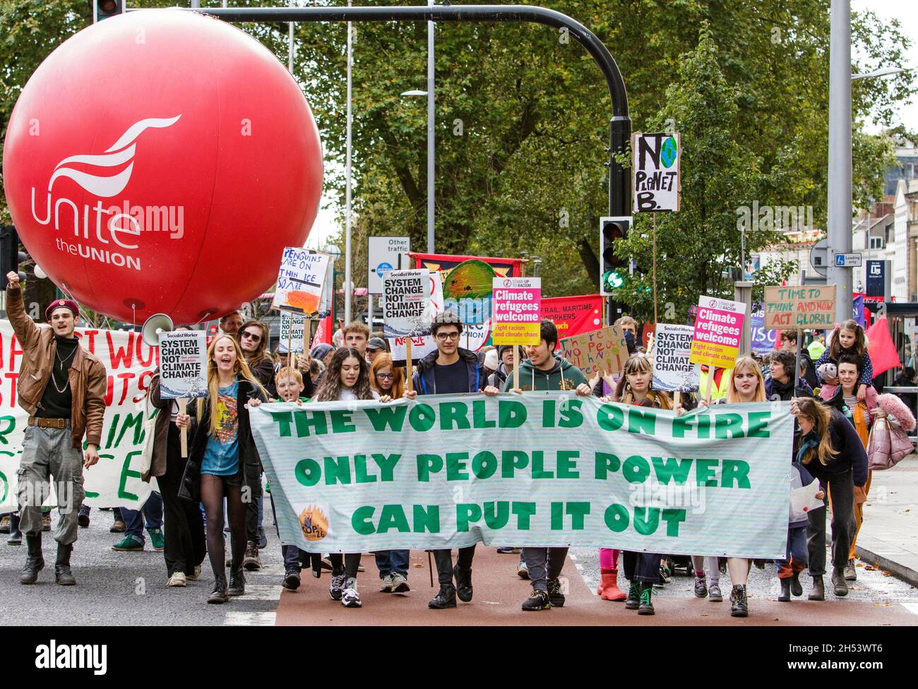 Bristol, UK, 6th November, 2021. Protesters carrying climate change banners and placards are pictured as they take part in a climate change protest march through the centre of Bristol. The protest was one of hundreds held around the world today as people took to the streets to push world leaders to act as their negotiators meet in Glasgow at the COP 2021 United Nations Climate Change Conference. Credit: Lynchpics/Alamy Live News Stock Photo