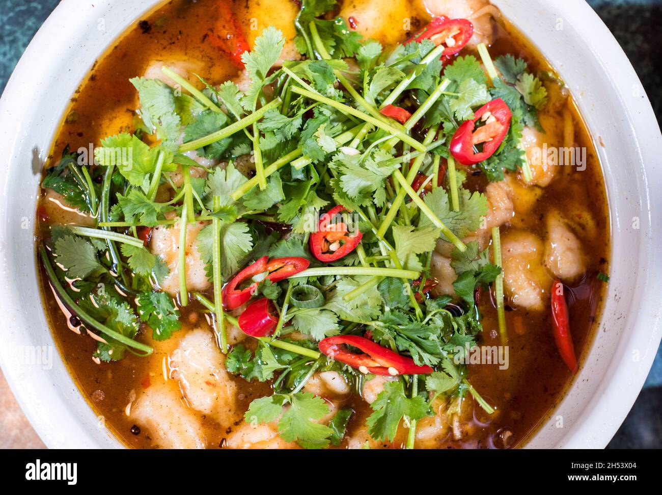 Sheffield, UK – 08 March 2018: Japanese seafood hotpot with chilli and coriander seasoning at Rice Inn, Devonshire Green Stock Photo