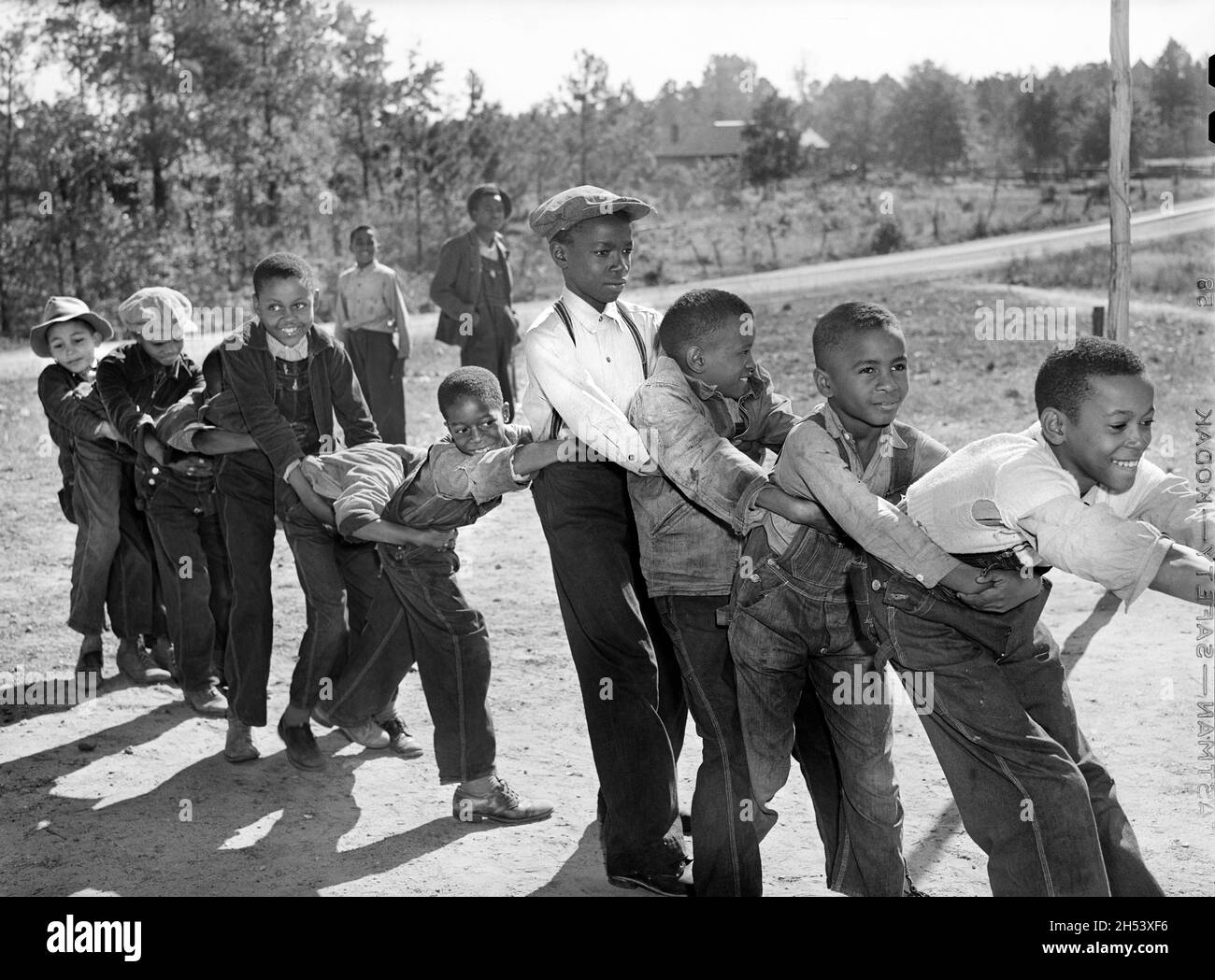 Group of Young Schoolboys playing during Recess, Alexander Community School, Greene County, Georgia, USA, Jack Delano, U.S. Farm Security Administration, U.S. Office of War Information Photograph Collection, November 1941 Stock Photo