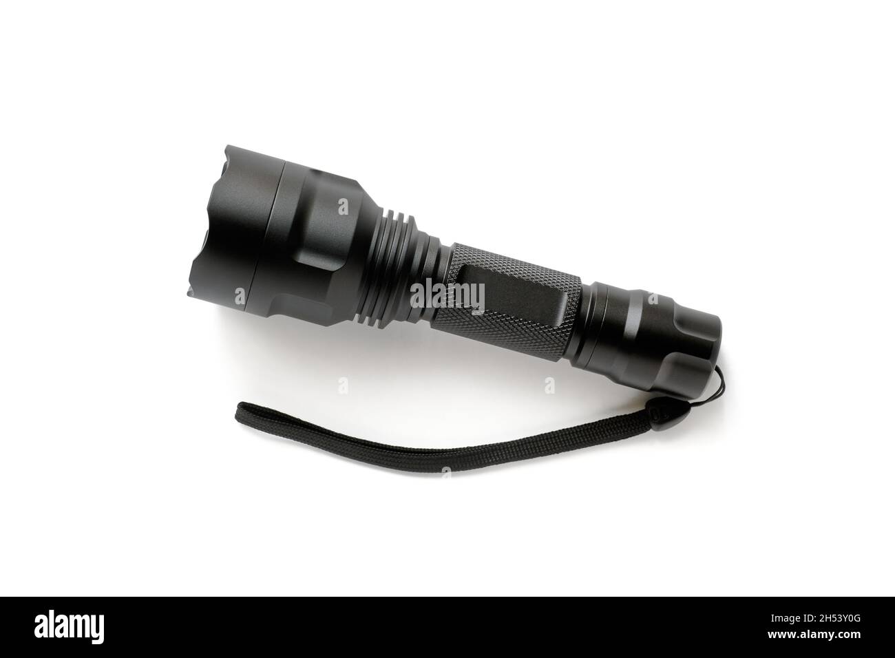 Black modern LED pocket flashlight made of aluminum, close-up Stock Photo