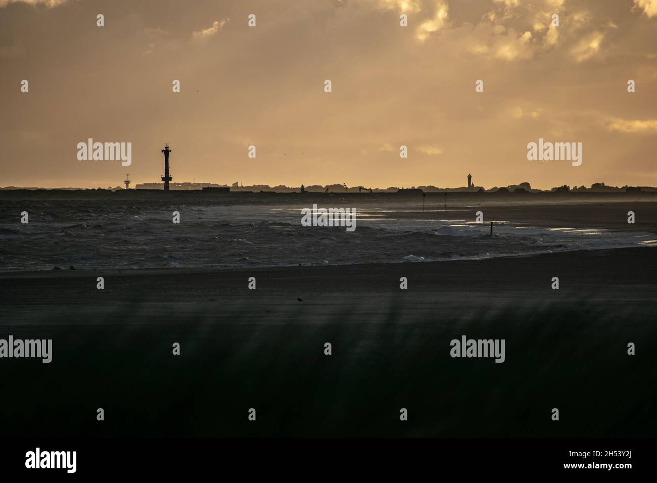 Cloudy sky over the sea and beach at sunset Stock Photo - Alamy