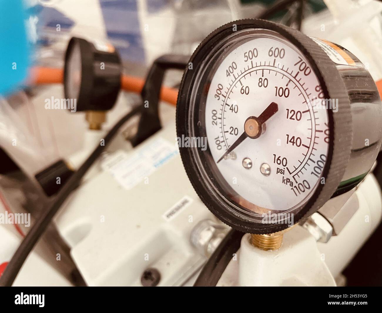 Closeup shot of a scientific pressure gauge instrument with a black