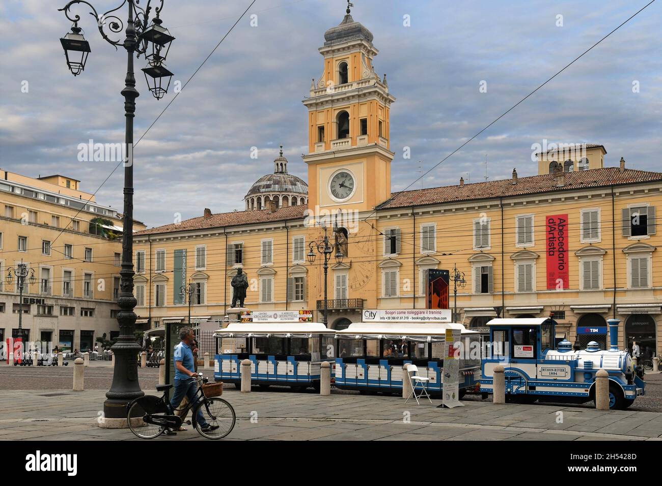 Giuseppe Garibaldi Square in the old town with a tourist little train and the Governor's Palace (13th century), Parma, Emilia-Romagna, Italy Stock Photo