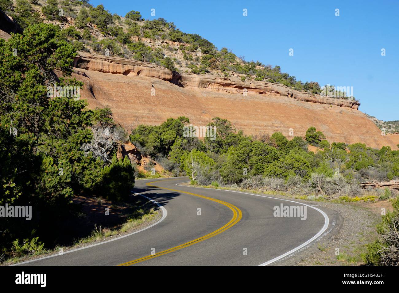 Two-lane road winding through Colorado National Monument Stock Photo
