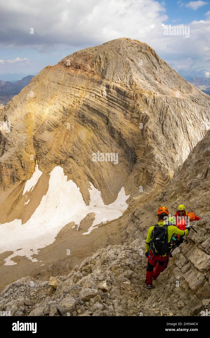 Italy Veneto - Hikers along the Ferrata Formenton, in the background ...