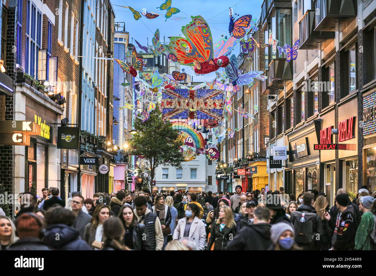 Carnaby Street, London, UK. 6th Nov, 2021. Carnaby street is busy with  shoppers and visitors who admire this year's installation, the Carnaby  Kaleidoscope which was revealed this week. Over 600 hand decorated