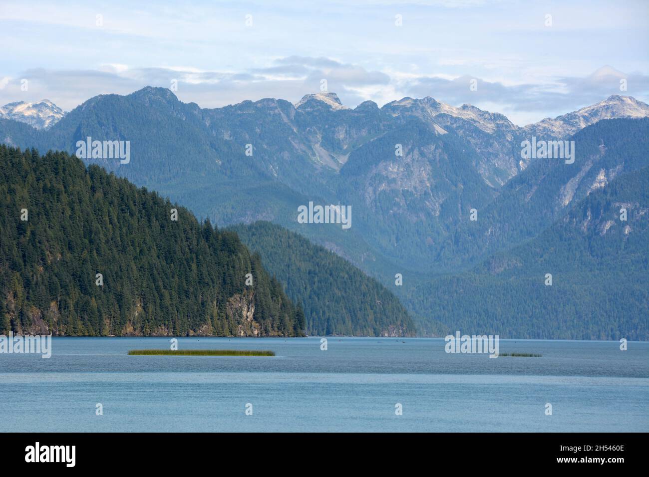 Pitt Lake, one of the world's largest tidal lakes, and the mountains of ...