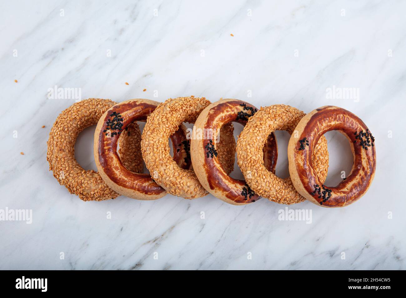 Turkish Bagel Kandil simiti with tea (stack of pastry). A savory, ring ...