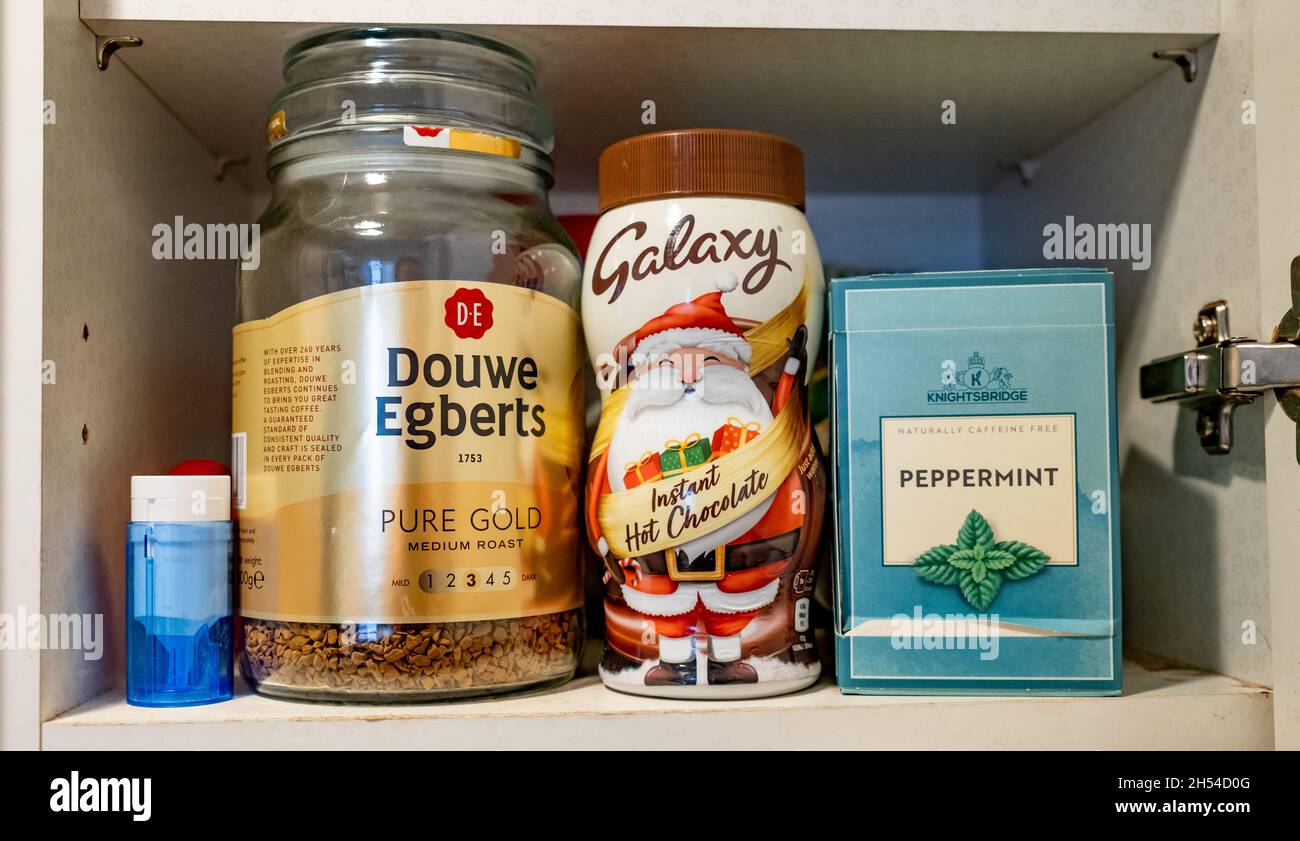 Norwich, Norfolk, UK November 05 2021. Kitchen cupboard containing a