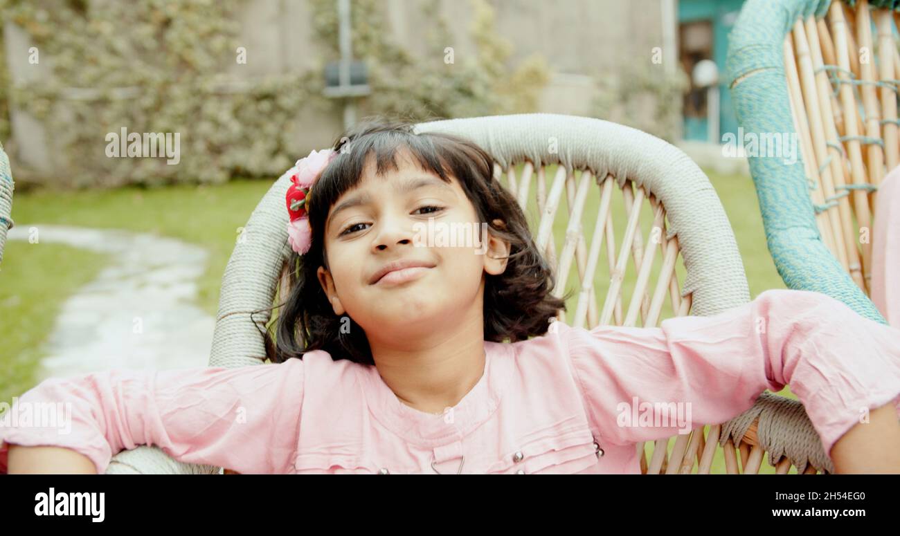 Portrait of a cheerful little girl from Inida outdoors Stock Photo - Alamy