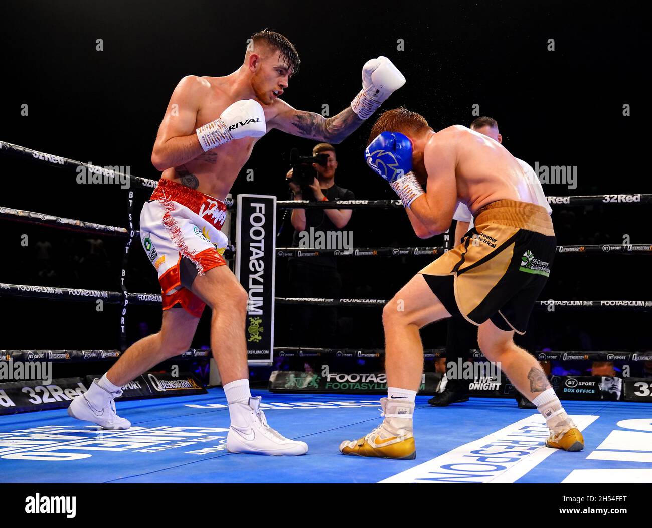 Eithan James (left) in action against Stu Greener during the Super-Lightweight Contest at Utilita Arena, Birmingham. Picture date: Saturday November 6, 2021. Stock Photo