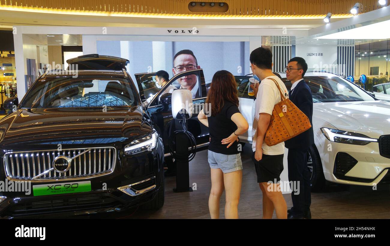 Shenzhen, China: car exhibition, young men and women watching newly ...