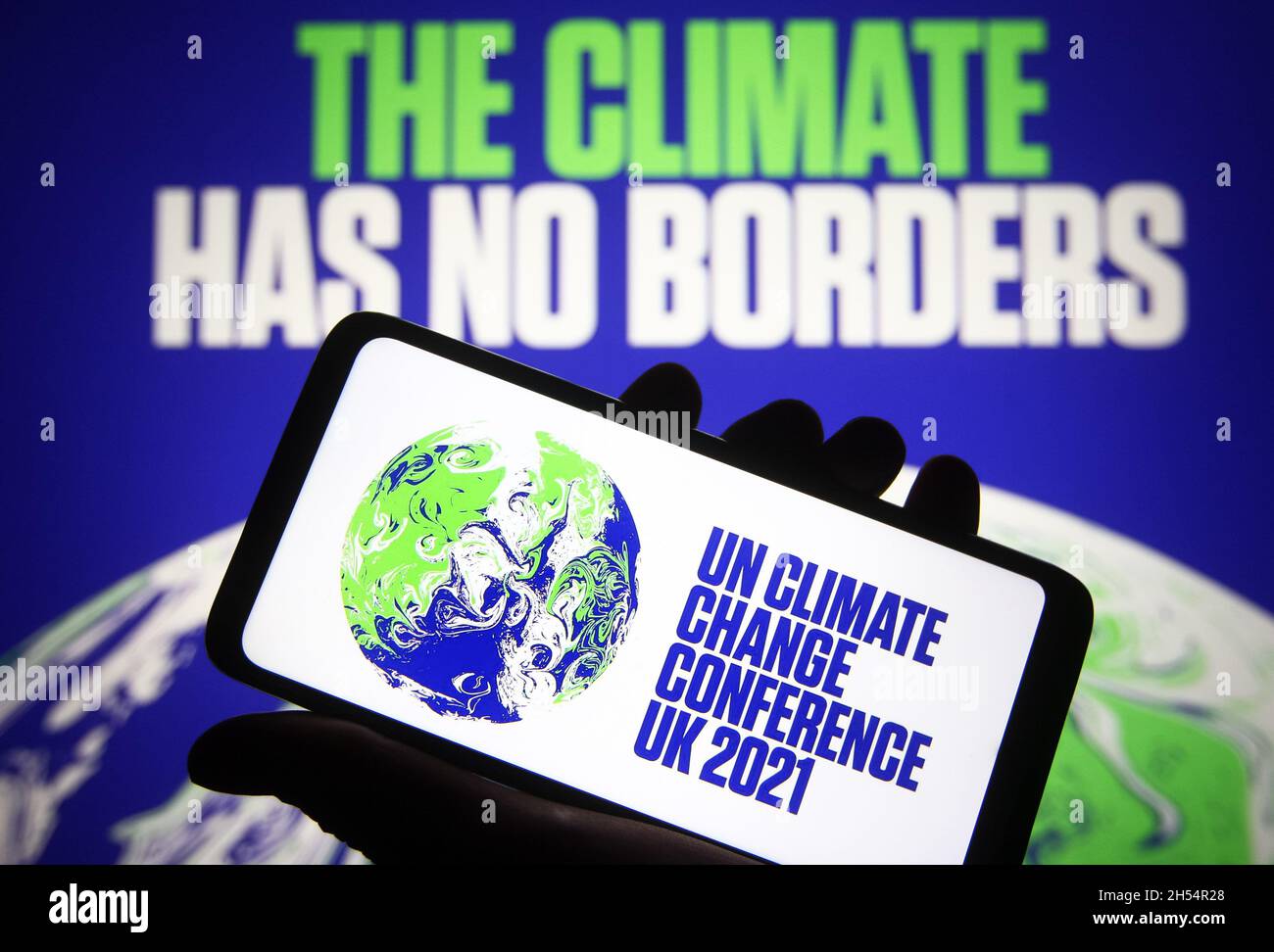 In this photo illustration the 2021 UN Climate Change Conference (COP26) logo of the 26th United Nations Climate Change conference is seen on a smartphone. Stock Photo