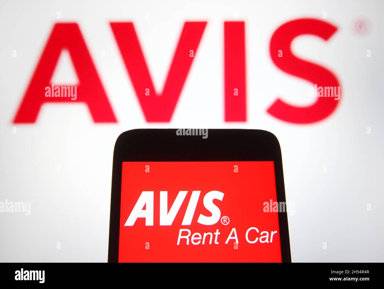In this photo illustration an Avis Rent a Car System, LLC logo is seen