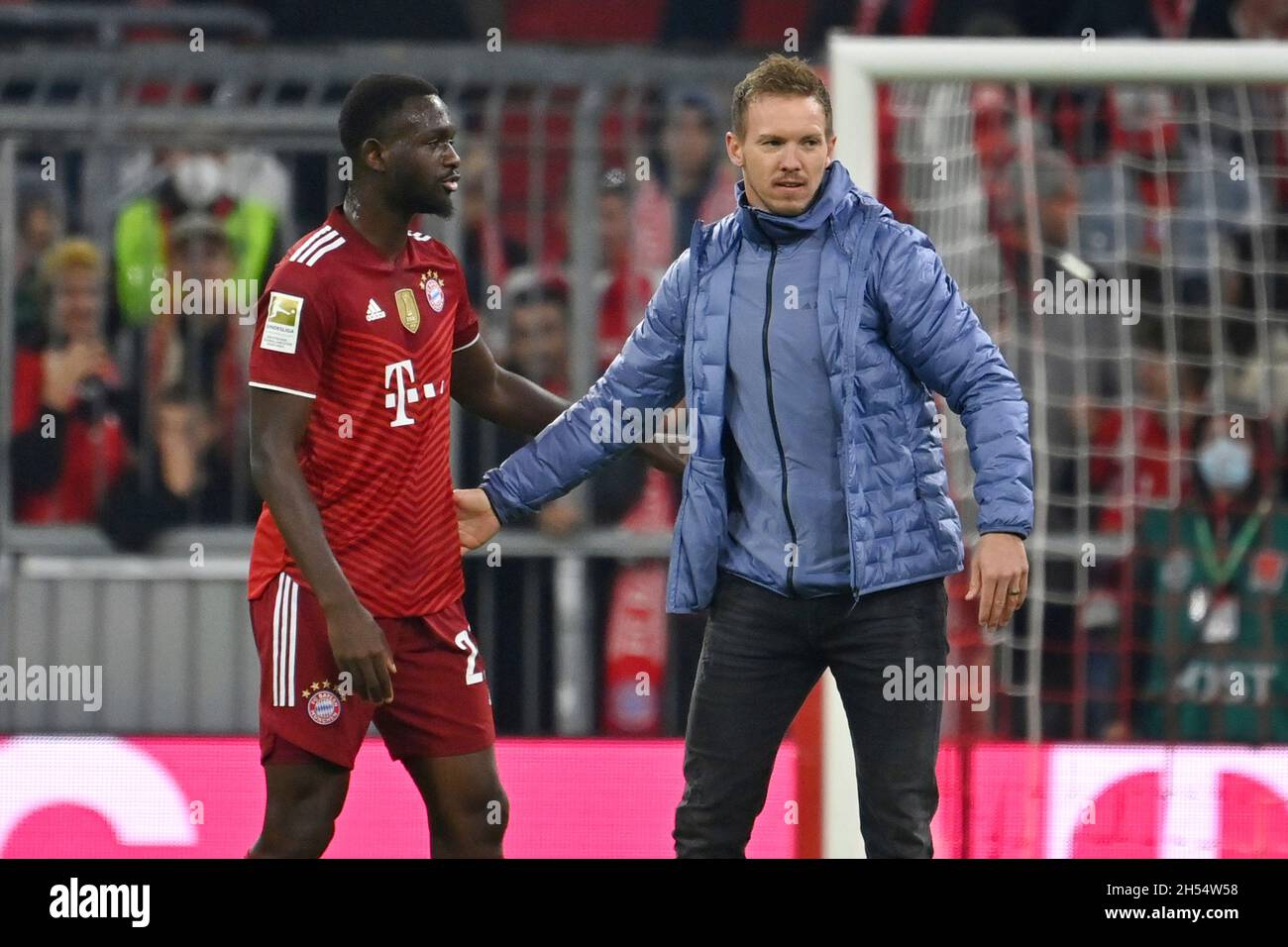 coach Julian NAGELSMANN (FC Bayern Munich) with Tanguy Nianzou Kouassi (FC Bayern  Munich) after the game.