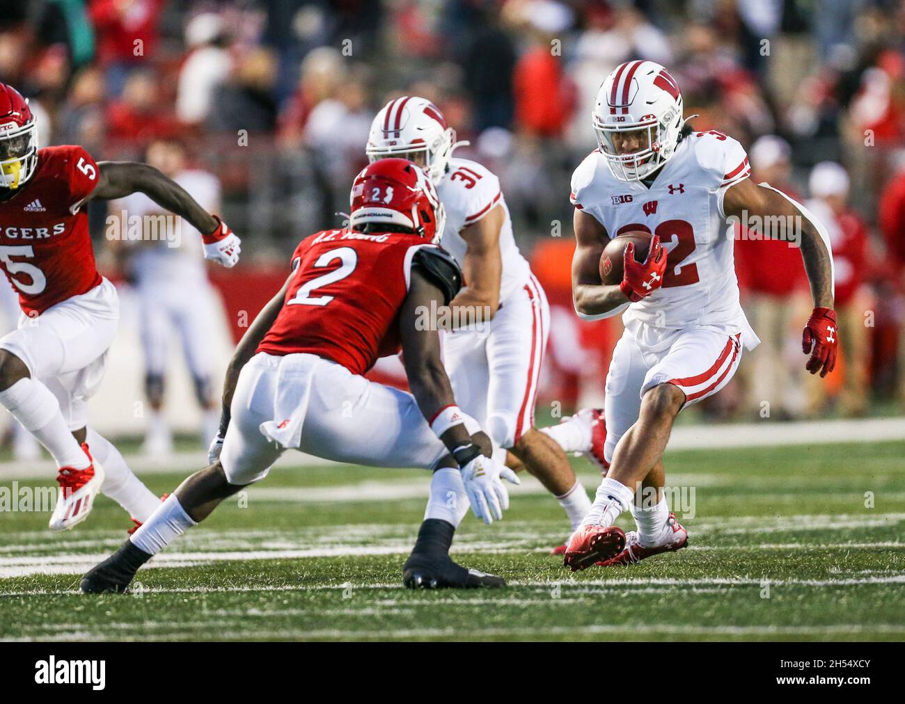 November 6, 2021: Wisconsin Badgers running back Julius Davis (32).tries to get past Rutgers Scarlet Knights defensive back Avery Young (2) during an NCAA football game between the Wisconsin Badgers and the Rutgers Scarlet Knights at SHI Stadium in Piscataway, NJ. Mike Langish/Cal Sport Media. Stock Photo