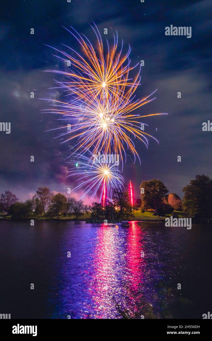 Royal Tunbridge Wells, Dunorlan Park, Kent, UK. 06th Nov, 2021. An organised firework display in a park, set across a boating lake, hosted by the Round table as a charity fundraiser. Stock Photo