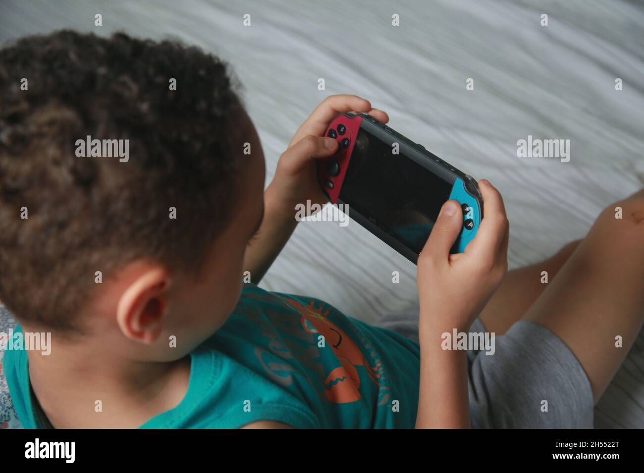 salvador, bahia, brazil - november 6, 2021: Child played Videgame Portatil in Salvador city. Stock Photo