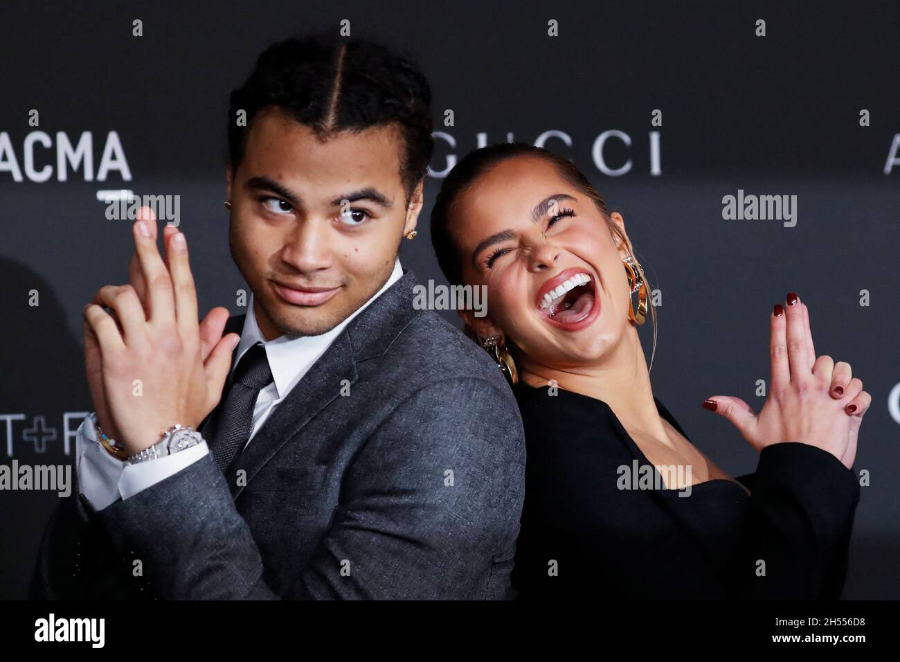 Rapper 24kGoldn and social media personality Addison Rae pose at the