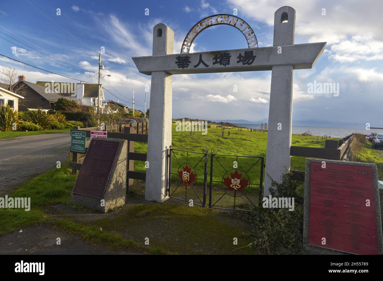 Cemetery Entrance Gate with Chinese Text Symbols at Harling Point in Oak Bay on Vancouver Island, Victoria British Columbia Canada Stock Photo