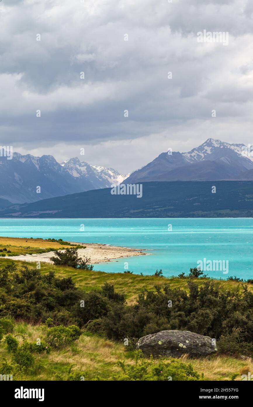 Cloudy day at Pukaki lake. South Island. New Zealand Stock Photo - Alamy