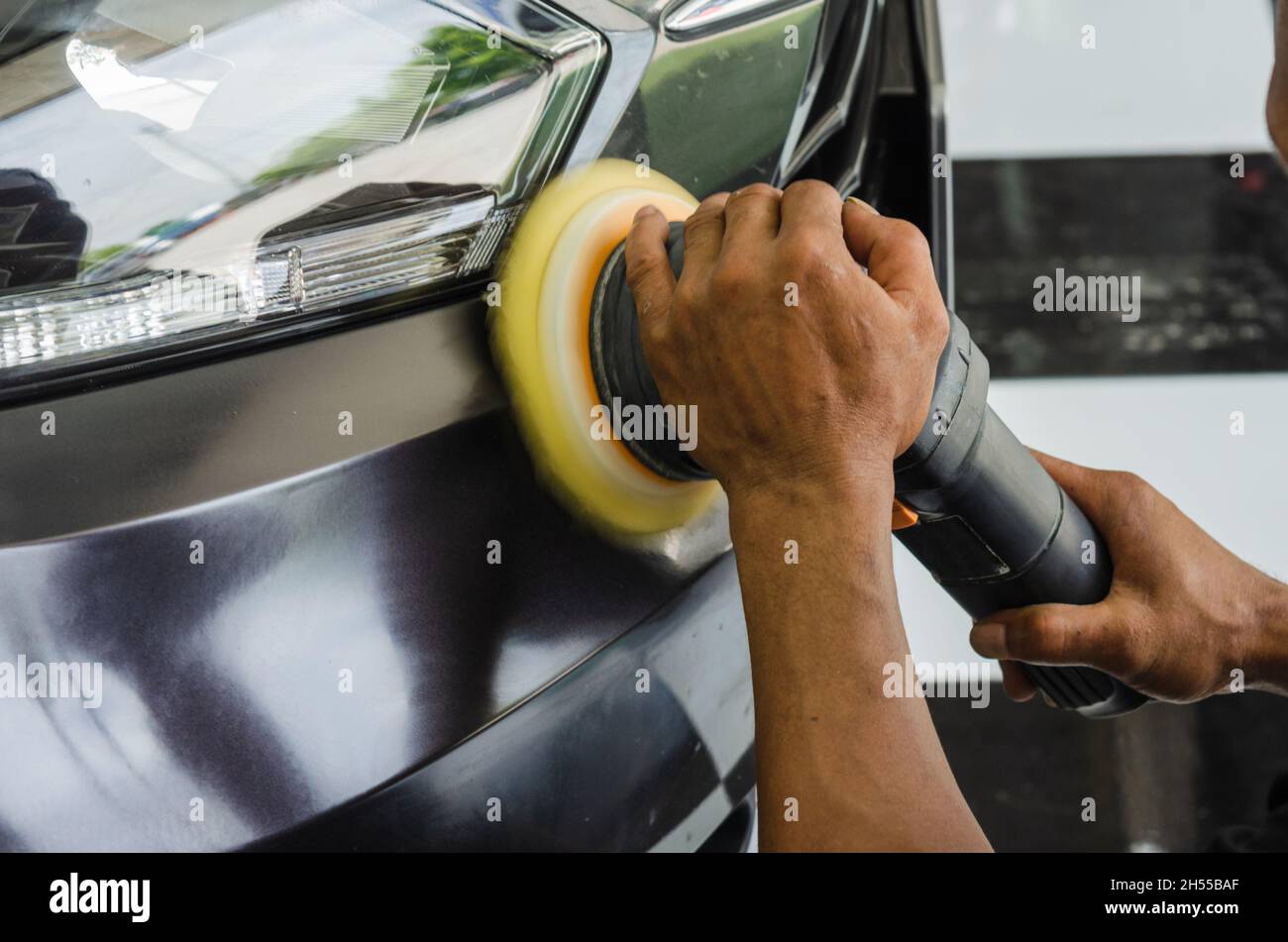 Mechanic hand holding the car polish Stock Photo Alamy