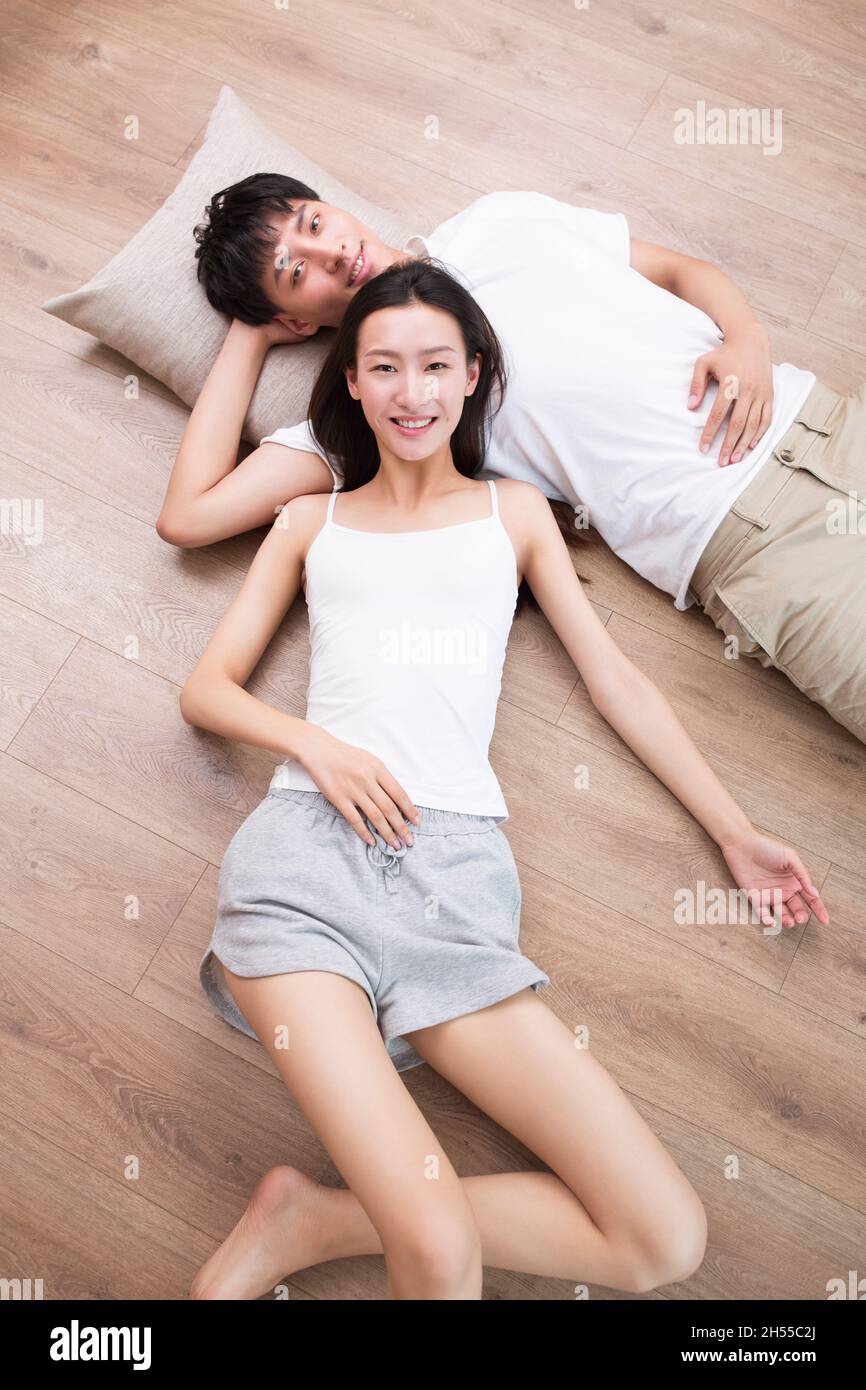 Young couple resting on the floor Stock Photo
