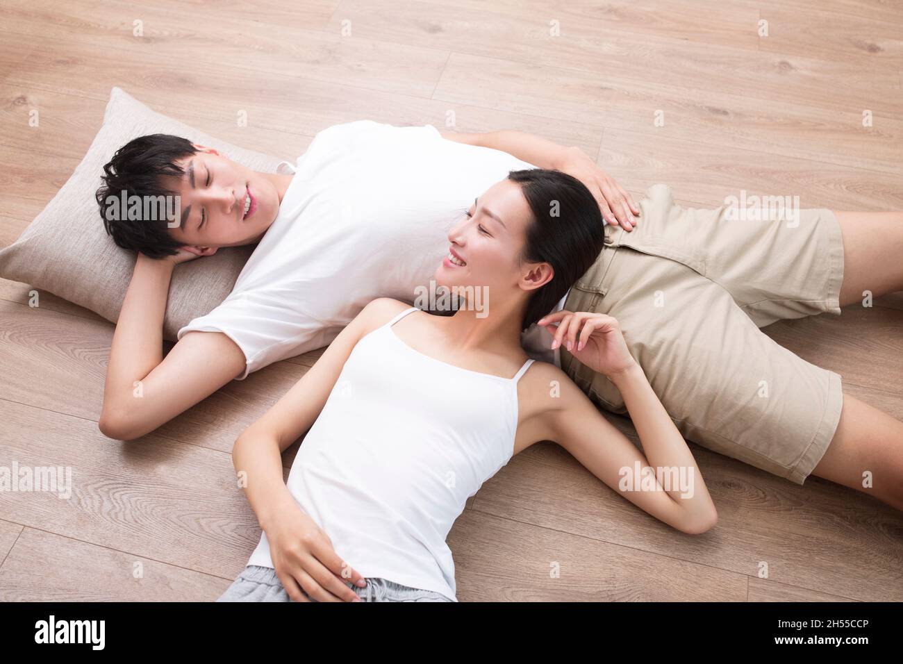 Young couple resting on the floor Stock Photo
