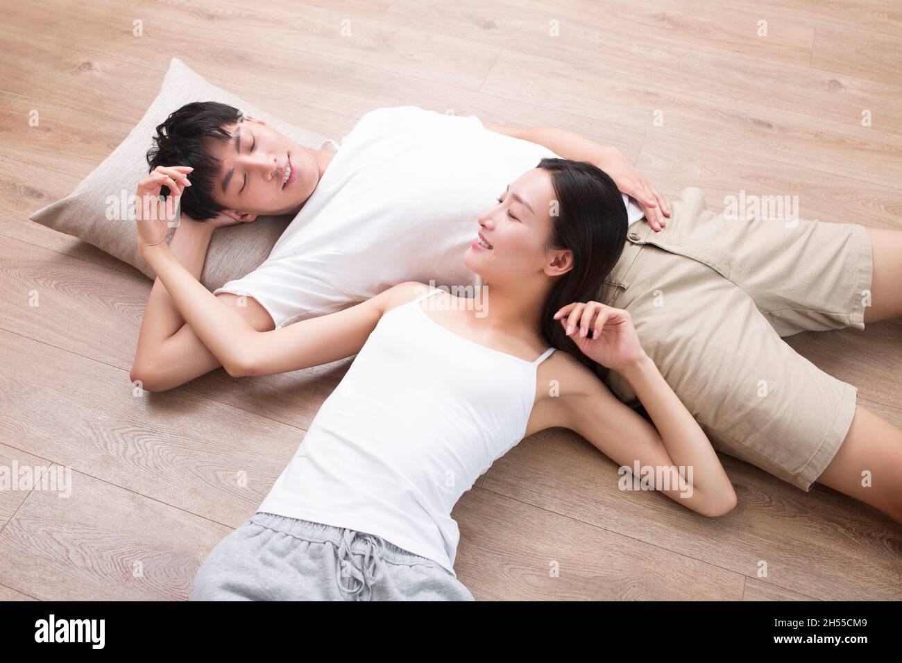 Young couple resting on the floor Stock Photo