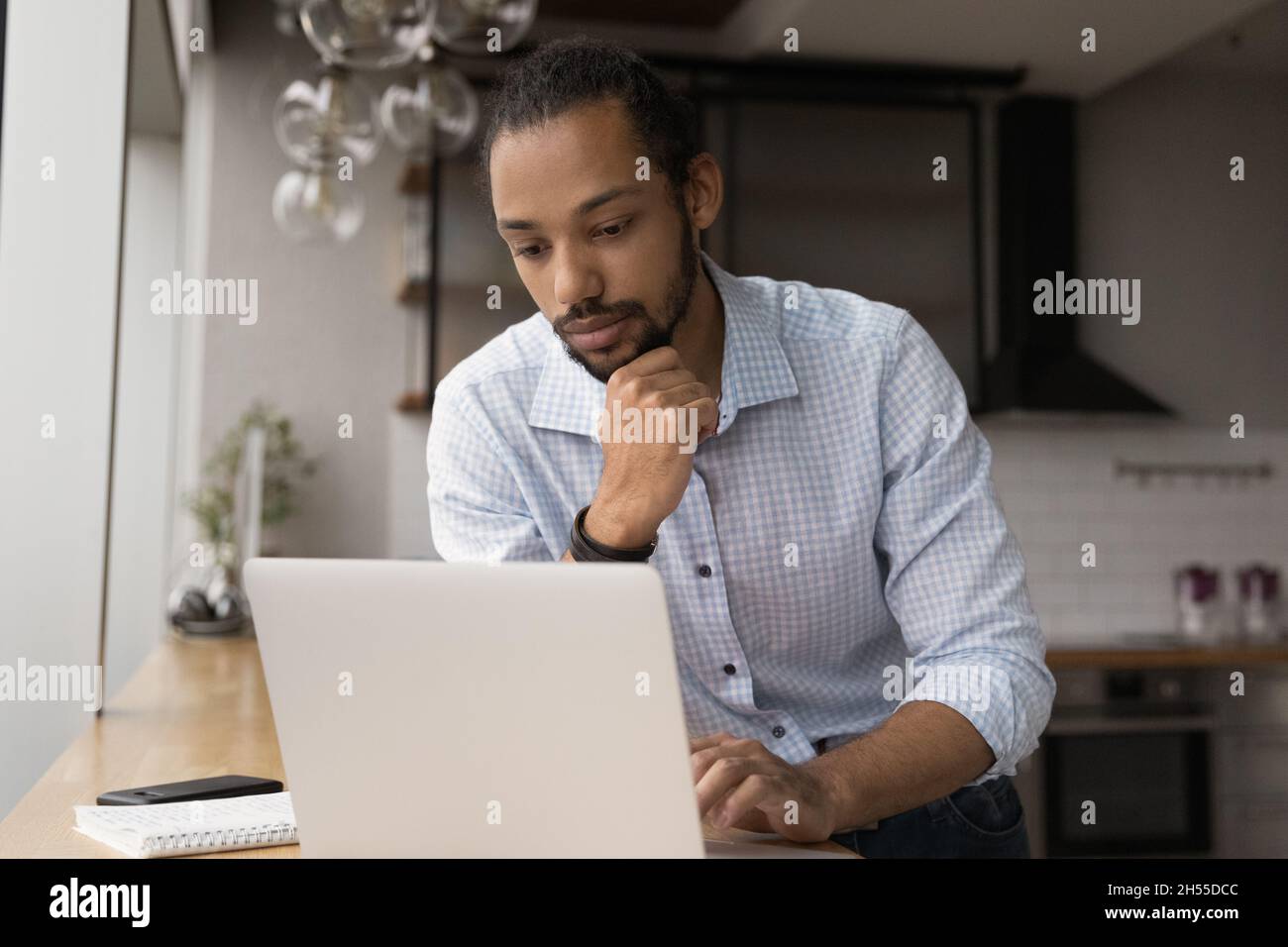 Pensive young african american businessman thinking of problem. Stock Photo