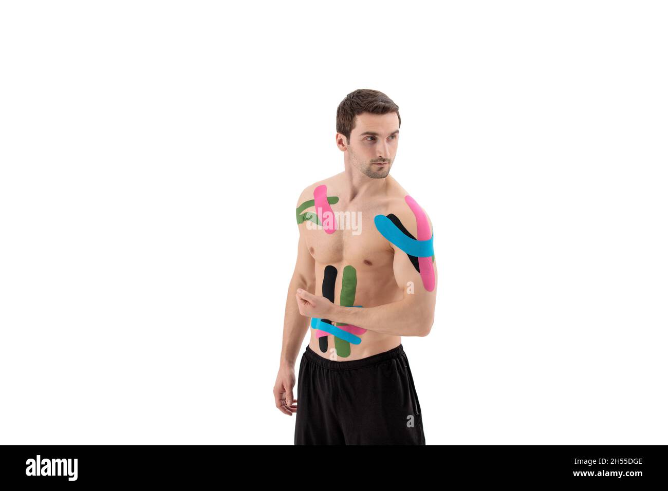 Male athlete with kinesio tape on the abdominal muscles and on the
