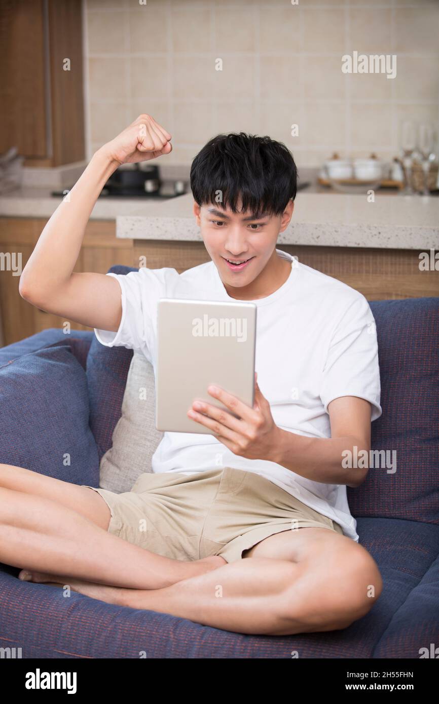 Back young people cheering sitting hi-res stock photography and images ...
