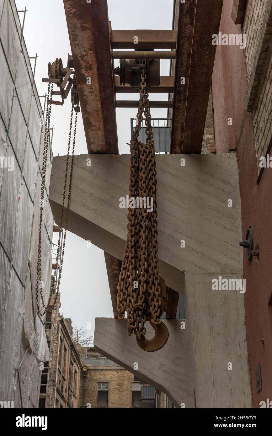Chain hoist for lifting weights in an old factory Stock Photo