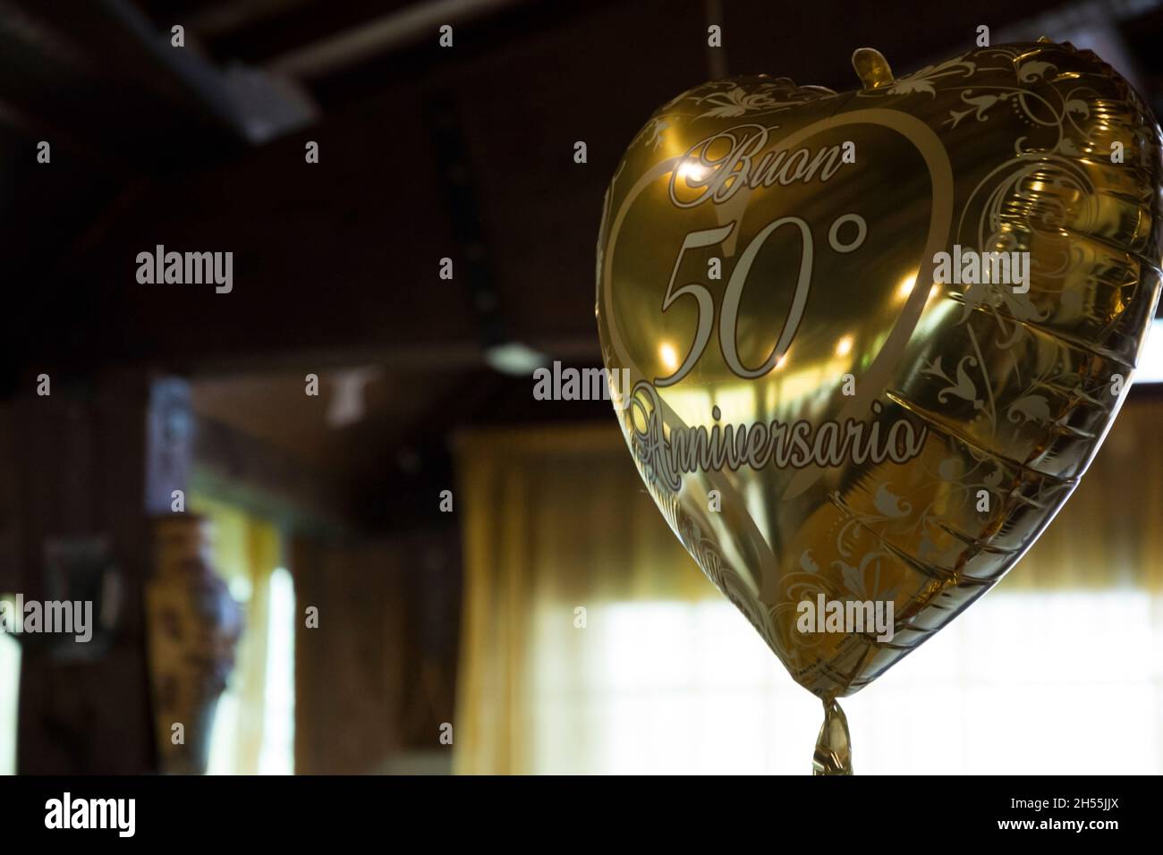 hearted-shaped golden ballon celebrating fiftieth anniversary Stock Photo