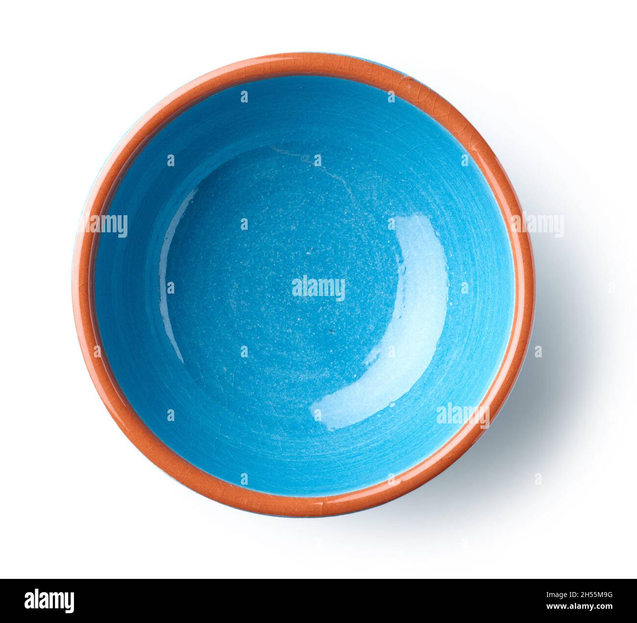 empty blue ceramic bowl isolated on white background, top view Stock Photo