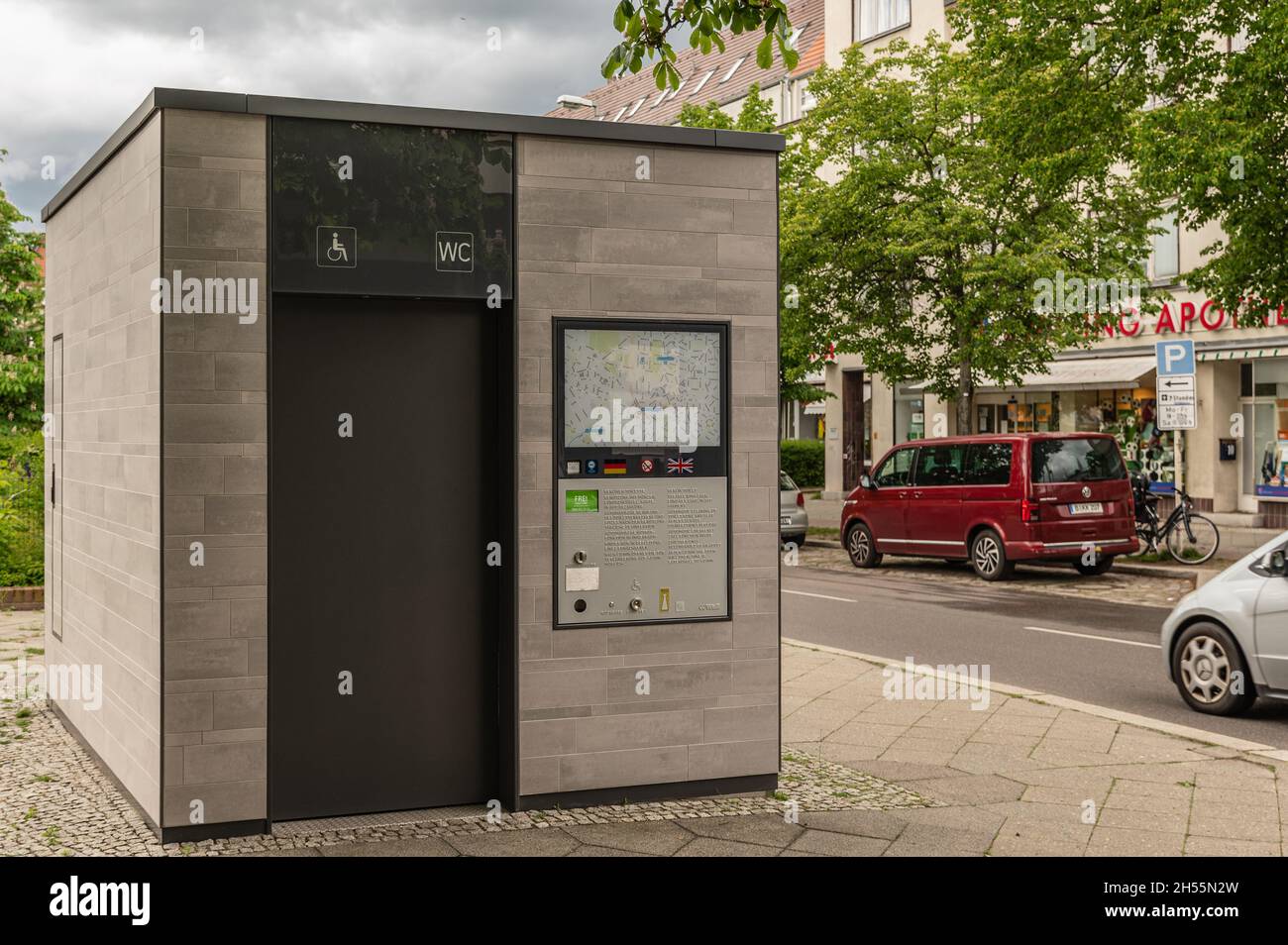pay toilet on the street in Berlin with a view from the front left at