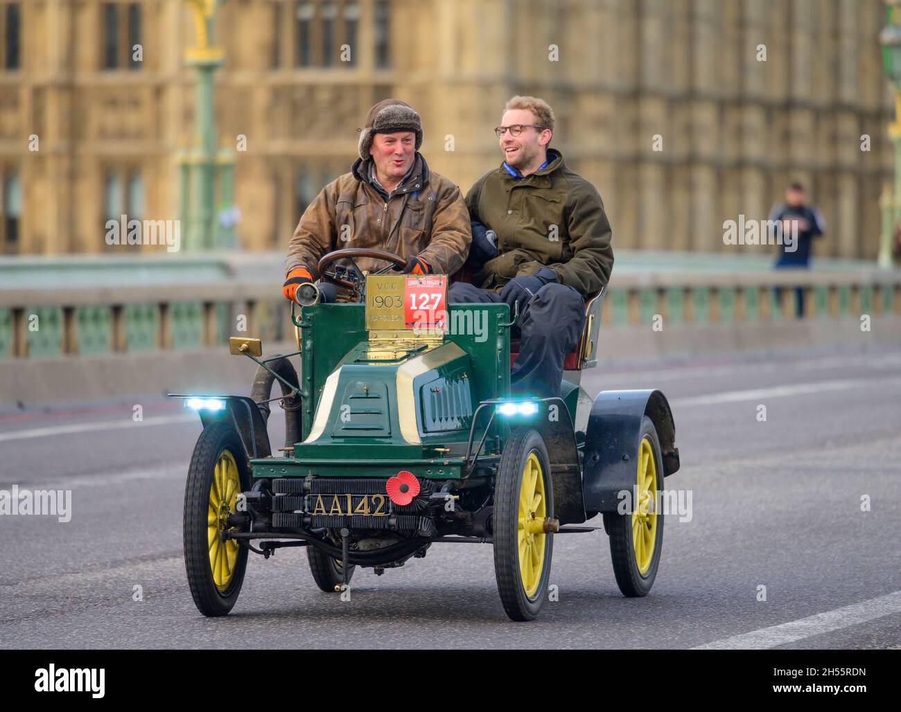 Westminster, London, UK. 7 November 2021. The World’s longest running motoring event, RM Sotheby’s London to Brighton veteran car run, leaves central London via Westminster Bridge on its 125th Anniversary year. The cars started from Hyde Park, with oldest vehicles in date order beginning the run at sunrise. Credit: Malcolm Park/Alamy Live News. Stock Photo