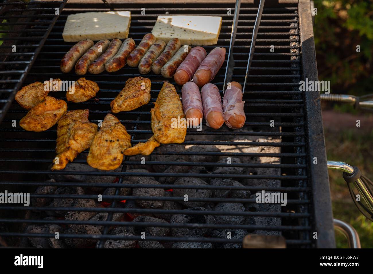 Preparing meat and cheese for dinner on the grill Stock Photo Alamy