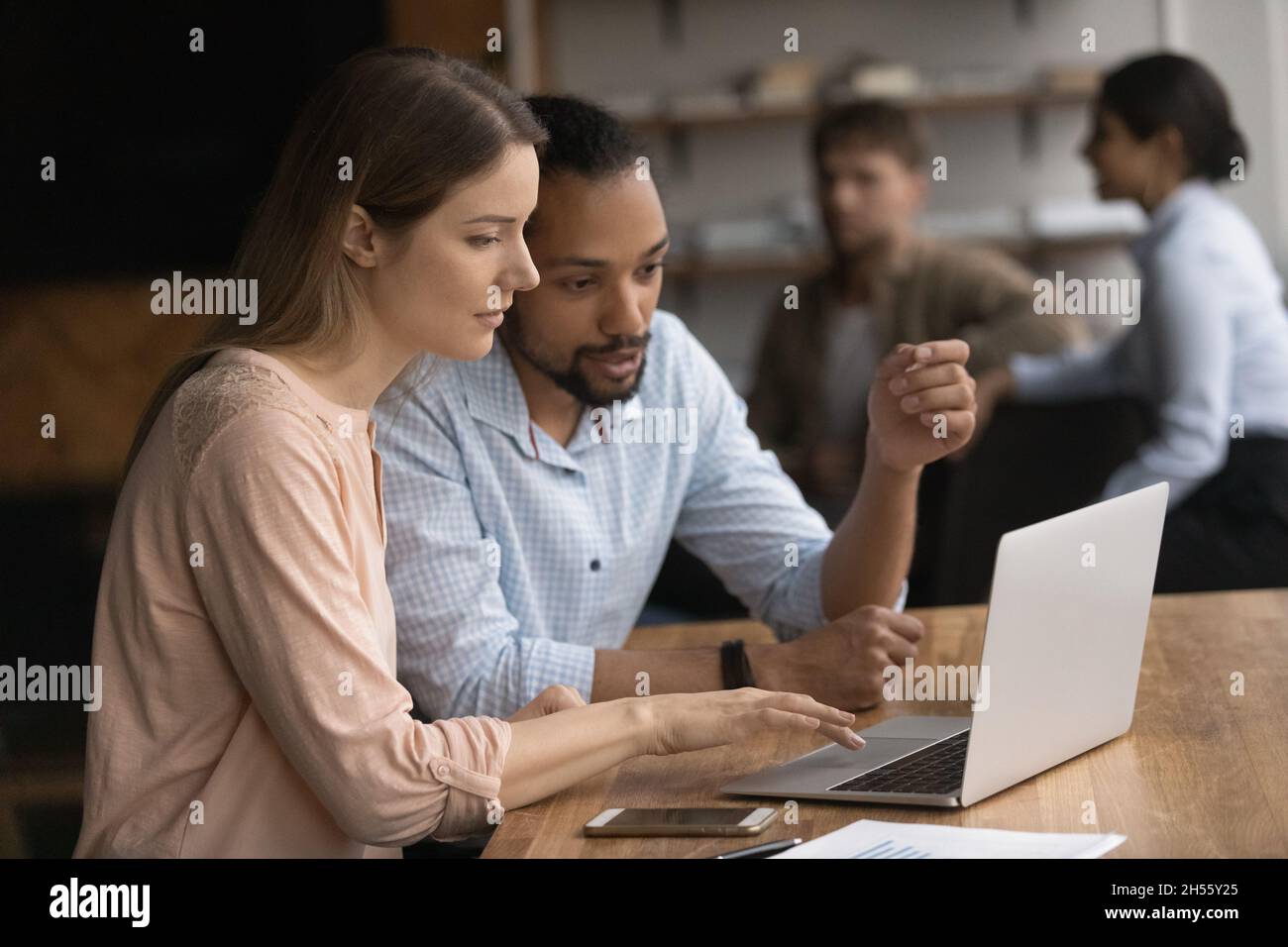 Concentrated young multiracial man hires stock photography and images