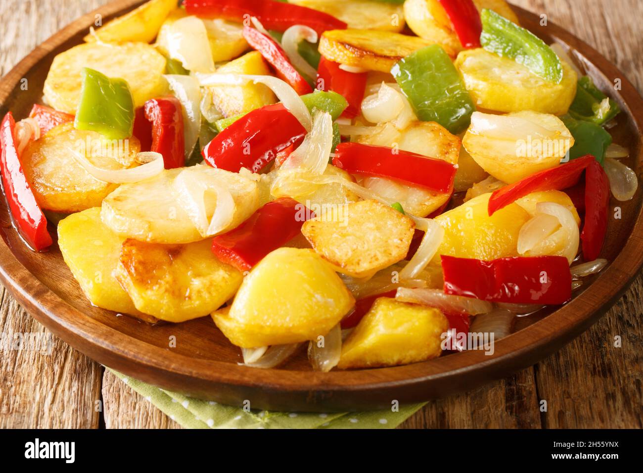Spanish Patatas a lo Pobre Poor Man's Potatoes close up in the plate on